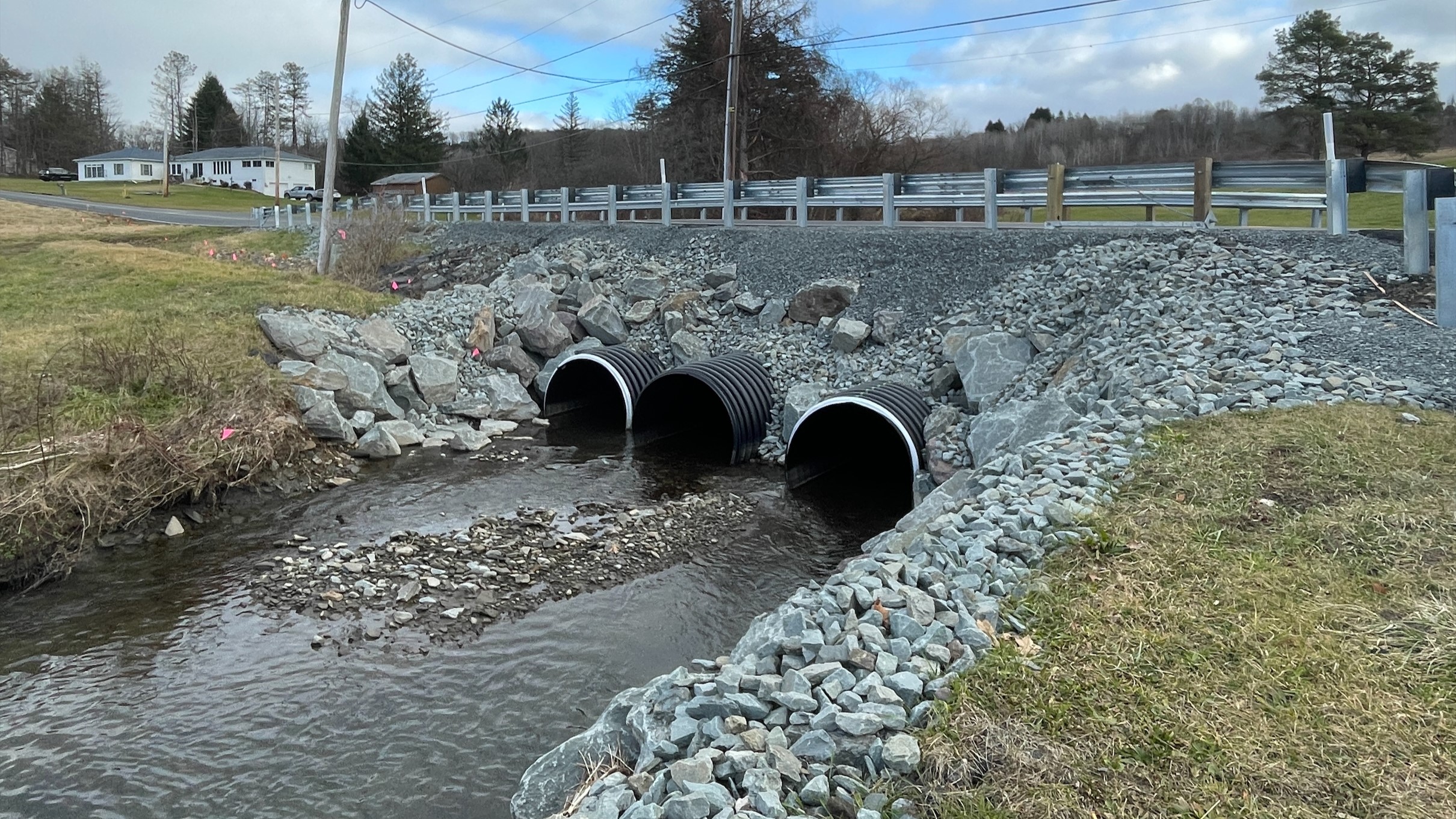 An image of three pipes under the newly constructed temporary bridge.